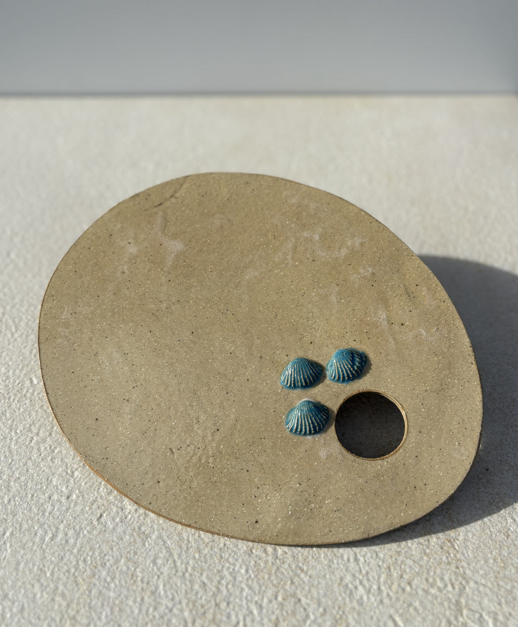 Planche à tartiner avec motifs coquillages